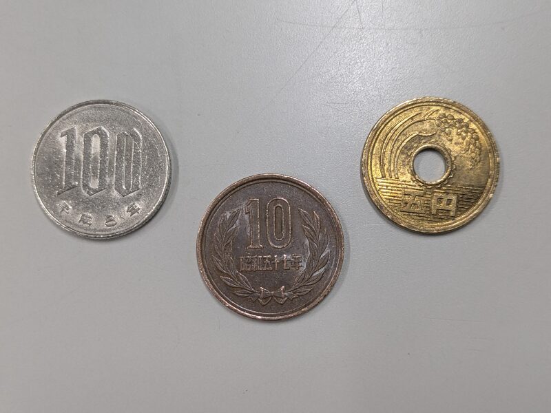 115円